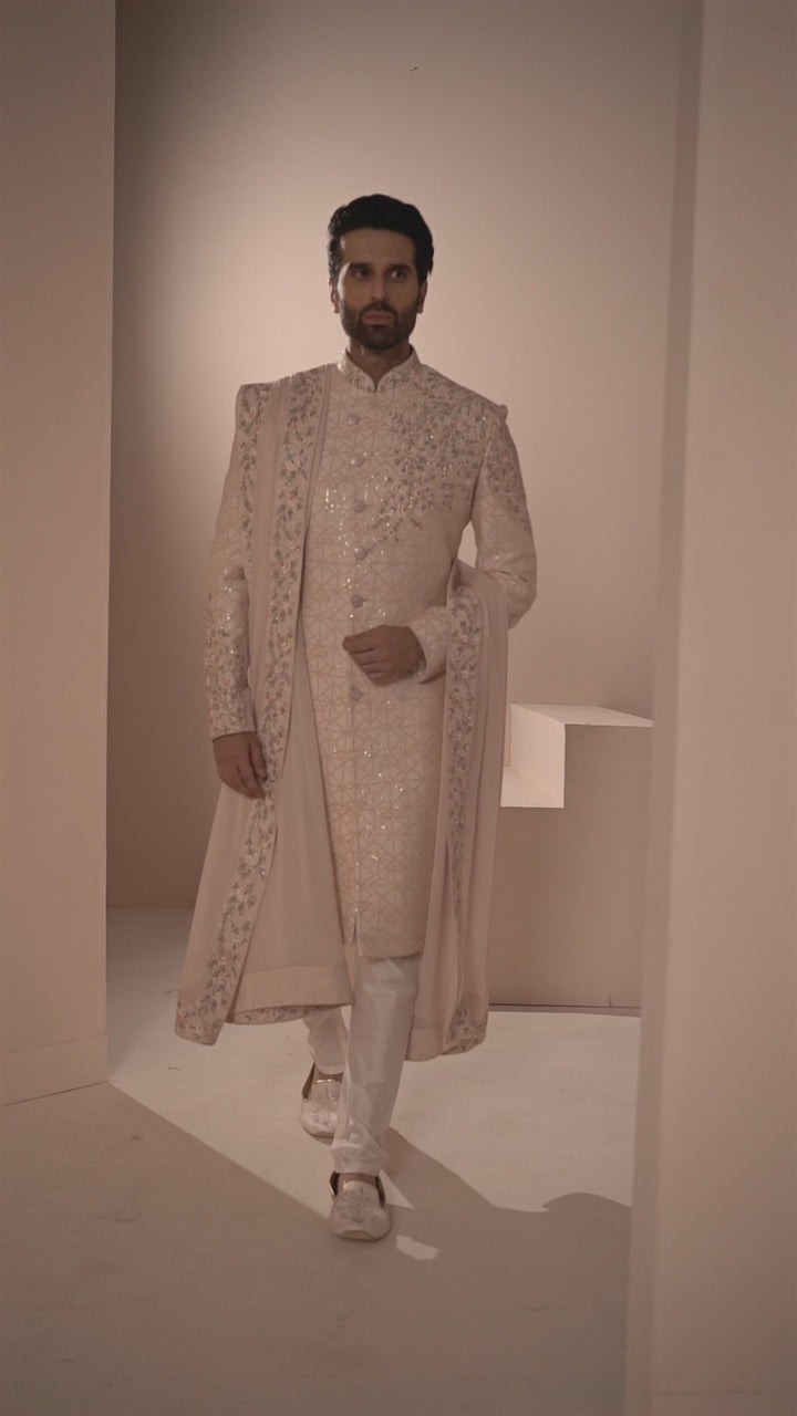 Light Pink Silk Sherwani with Geometric base & Floral Placement.