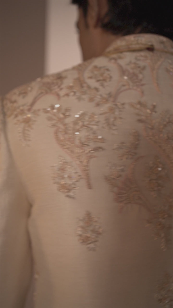 Light Peach Silk Sherwani with Intricate Floral Motifs.