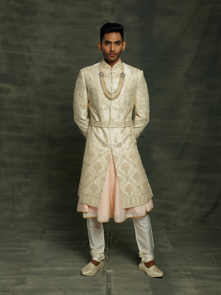 Off-white sherwani with self to self floral motifs