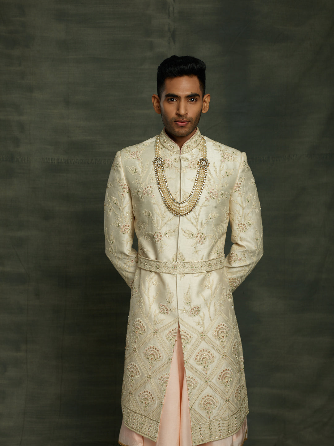 Off-white sherwani with self to self floral motifs