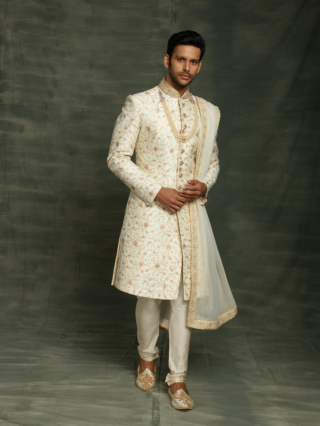 off-white sherwani with dupatta.