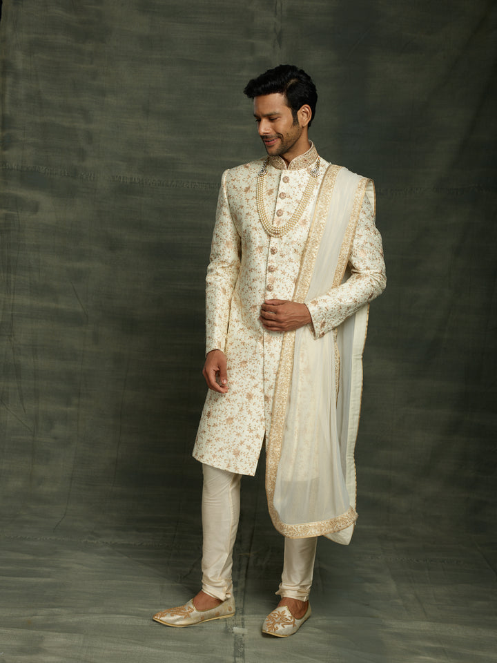 off-white sherwani with dupatta.