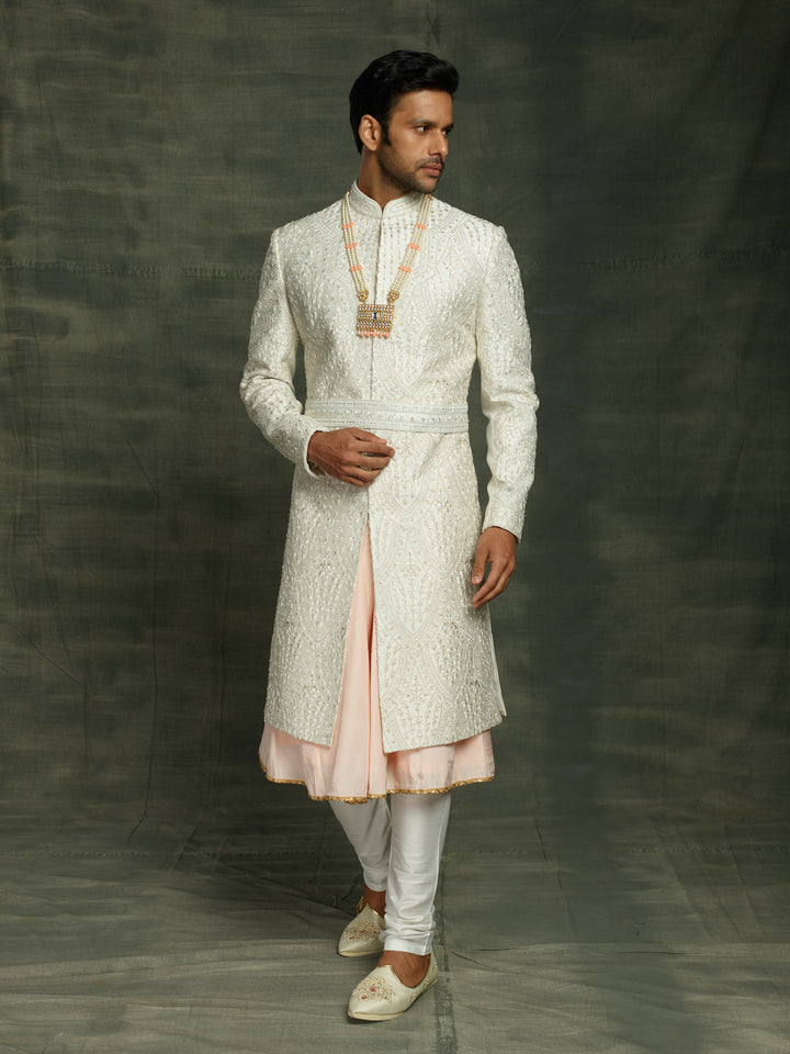 Groom's wear sherwani in white.