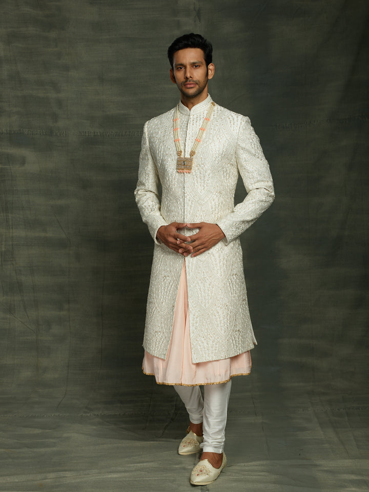 Groom's wear sherwani in white.