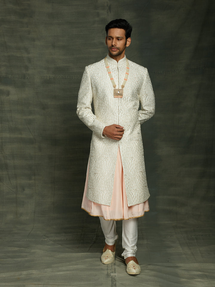 Groom's wear sherwani in white.