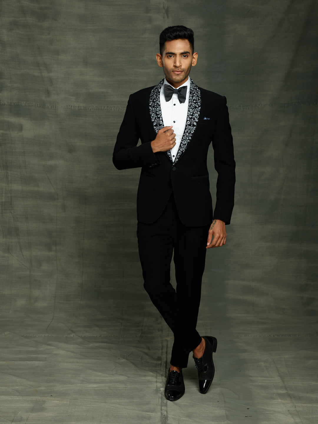 Black suit with stylish lapel.