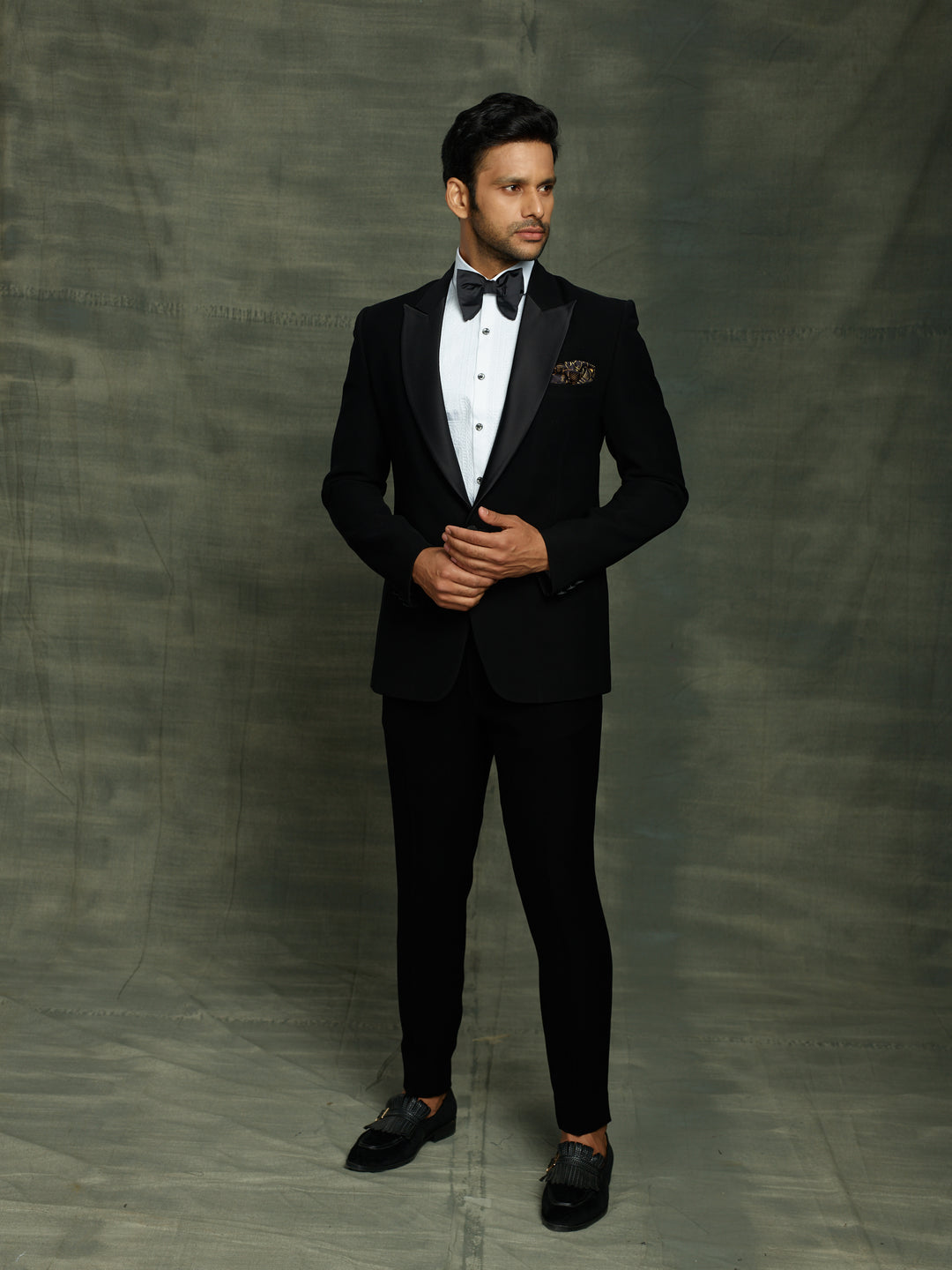 Classic black suit with waist belt.