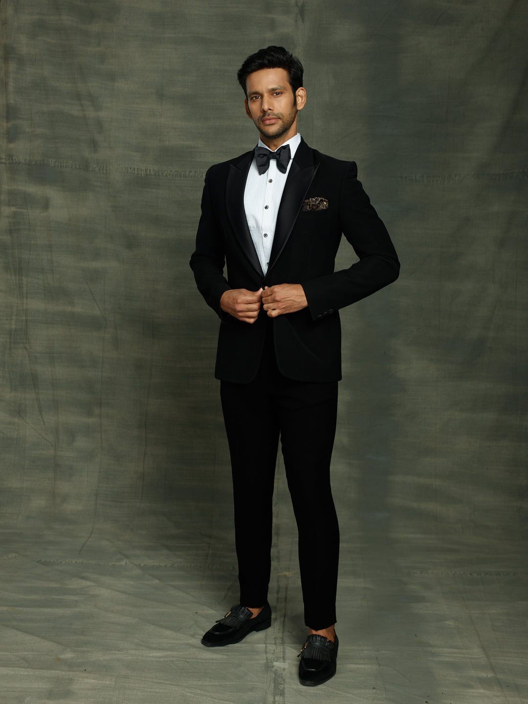 Classic black suit with waist belt.