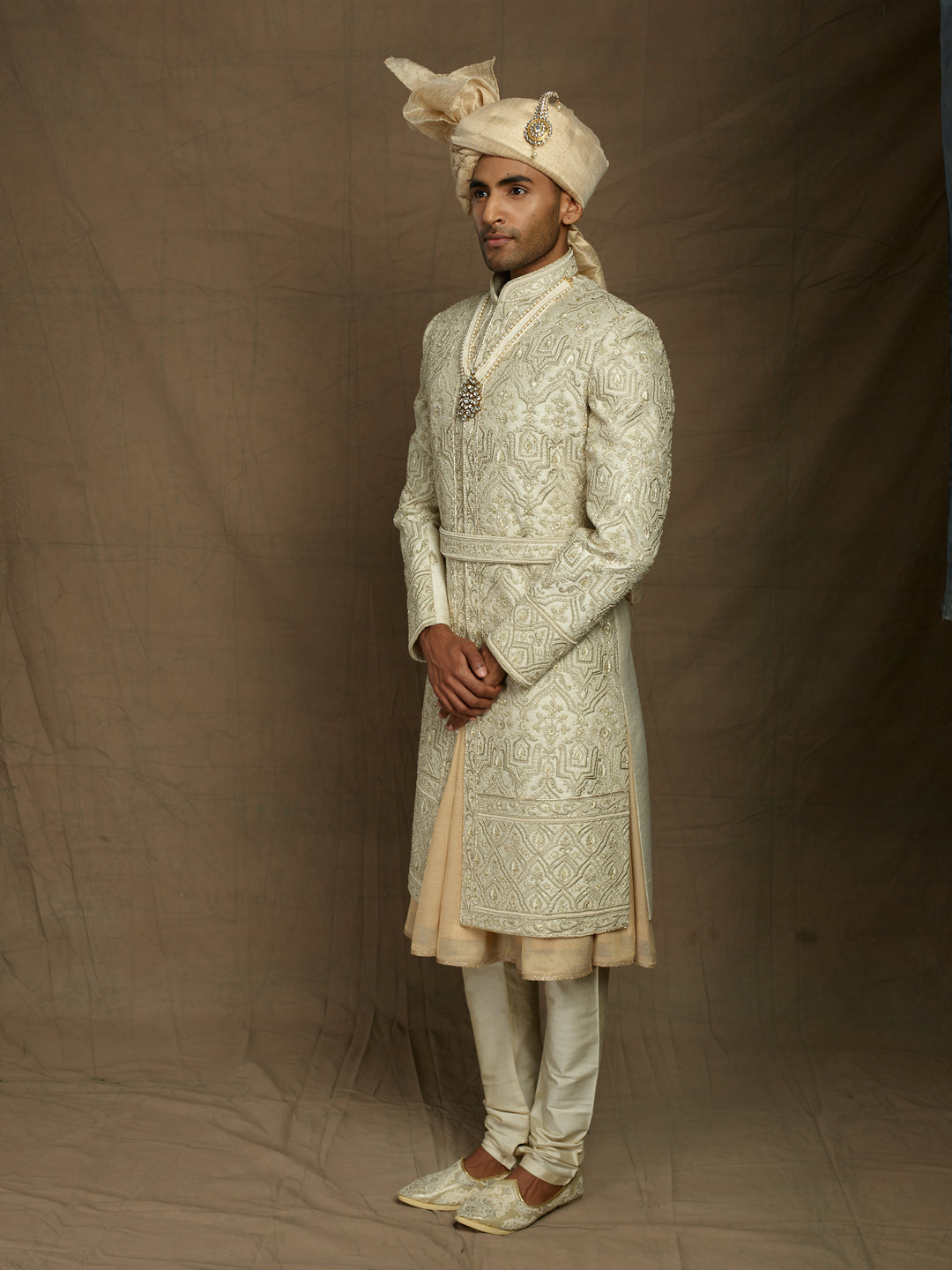 cream sherwani with self embossed resham work