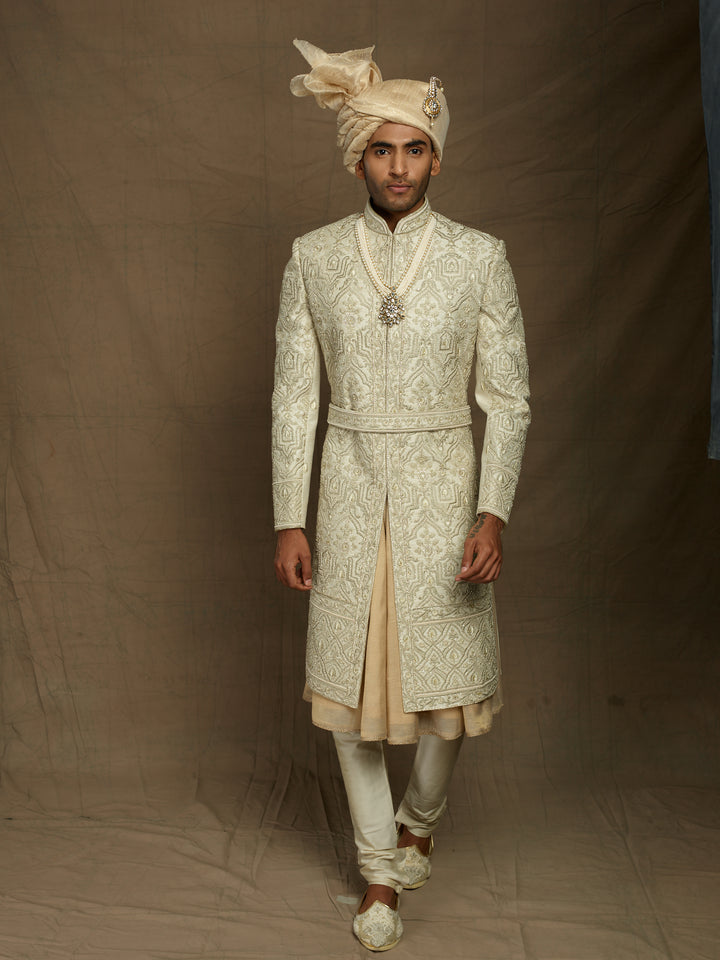 cream sherwani with self embossed resham work