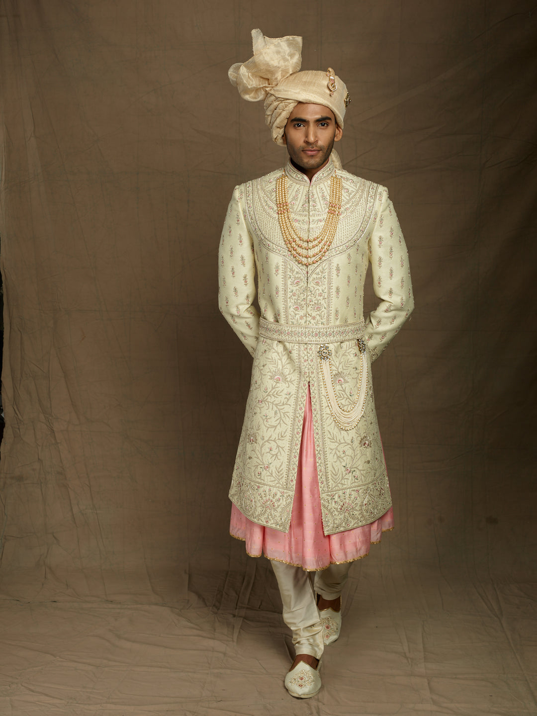 Heavy groom's wear sherwani with pink combination.