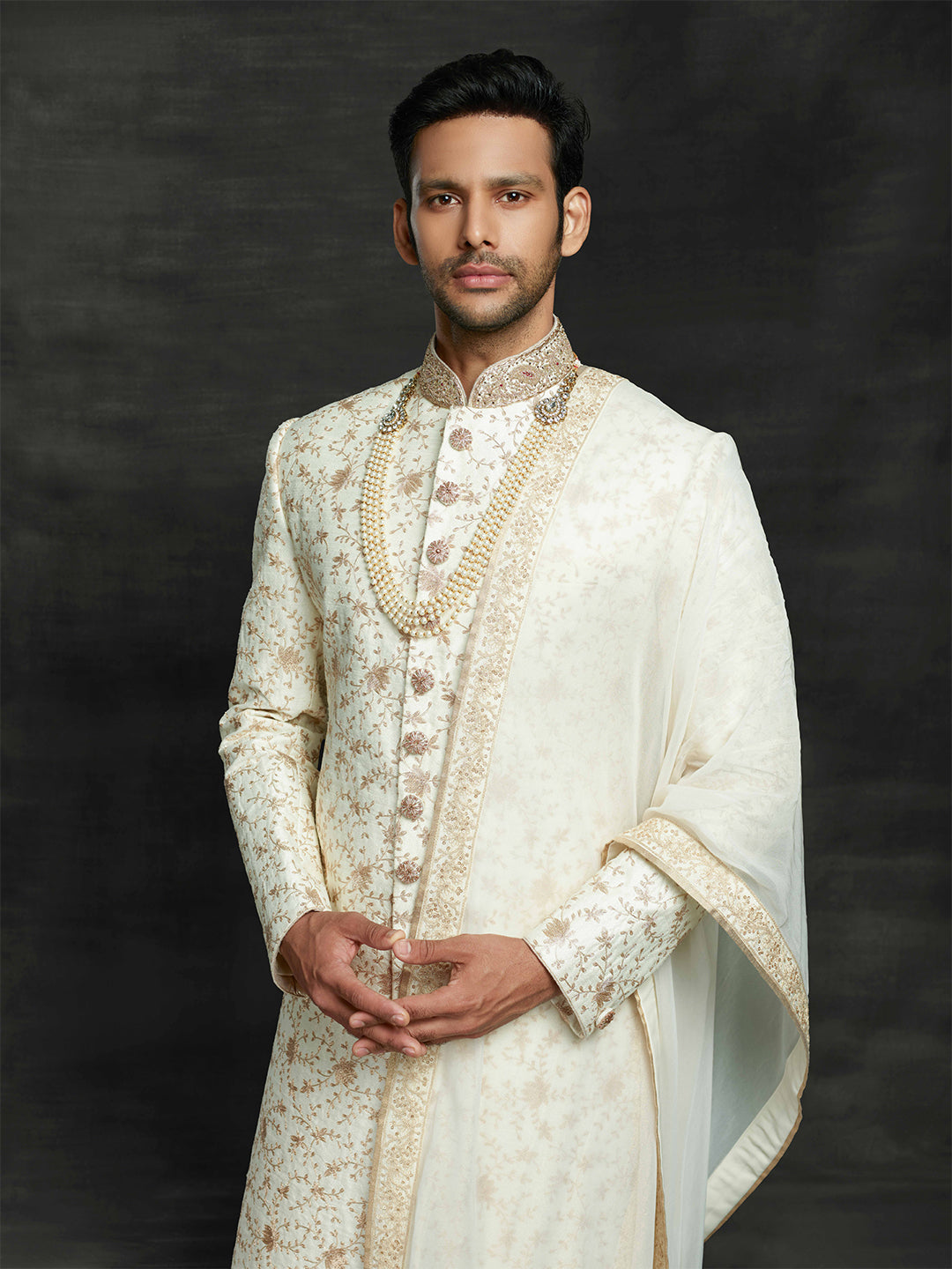 off-white sherwani with dupatta.