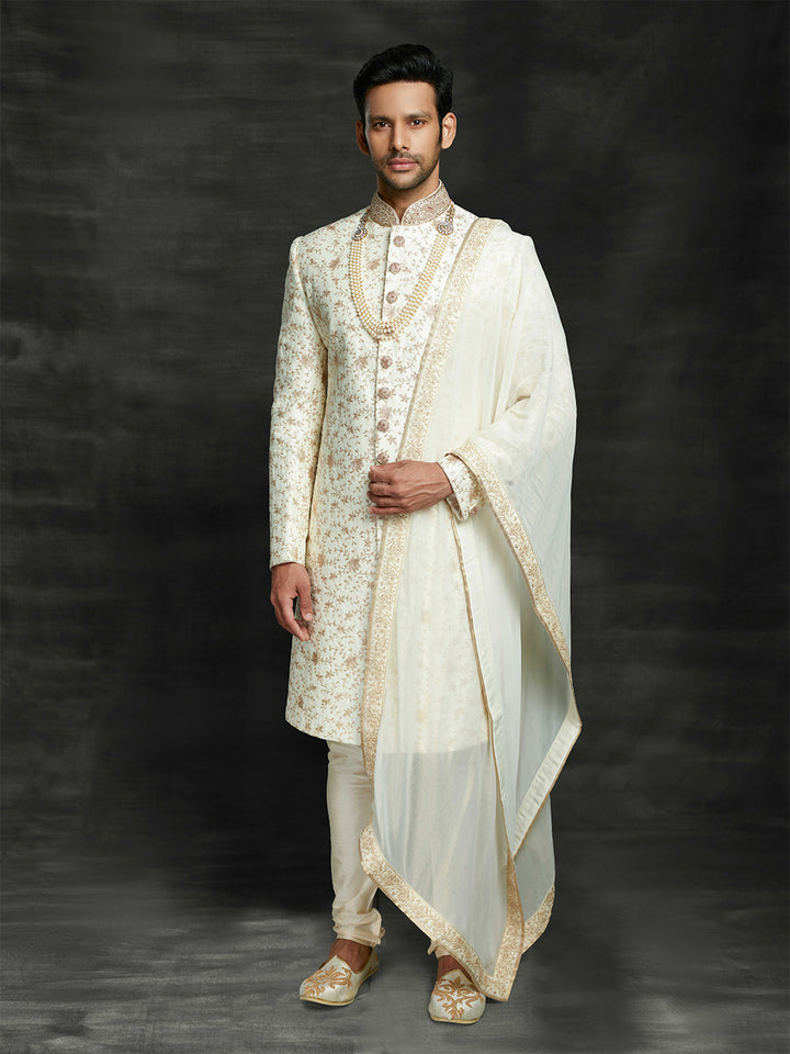off-white sherwani with dupatta.