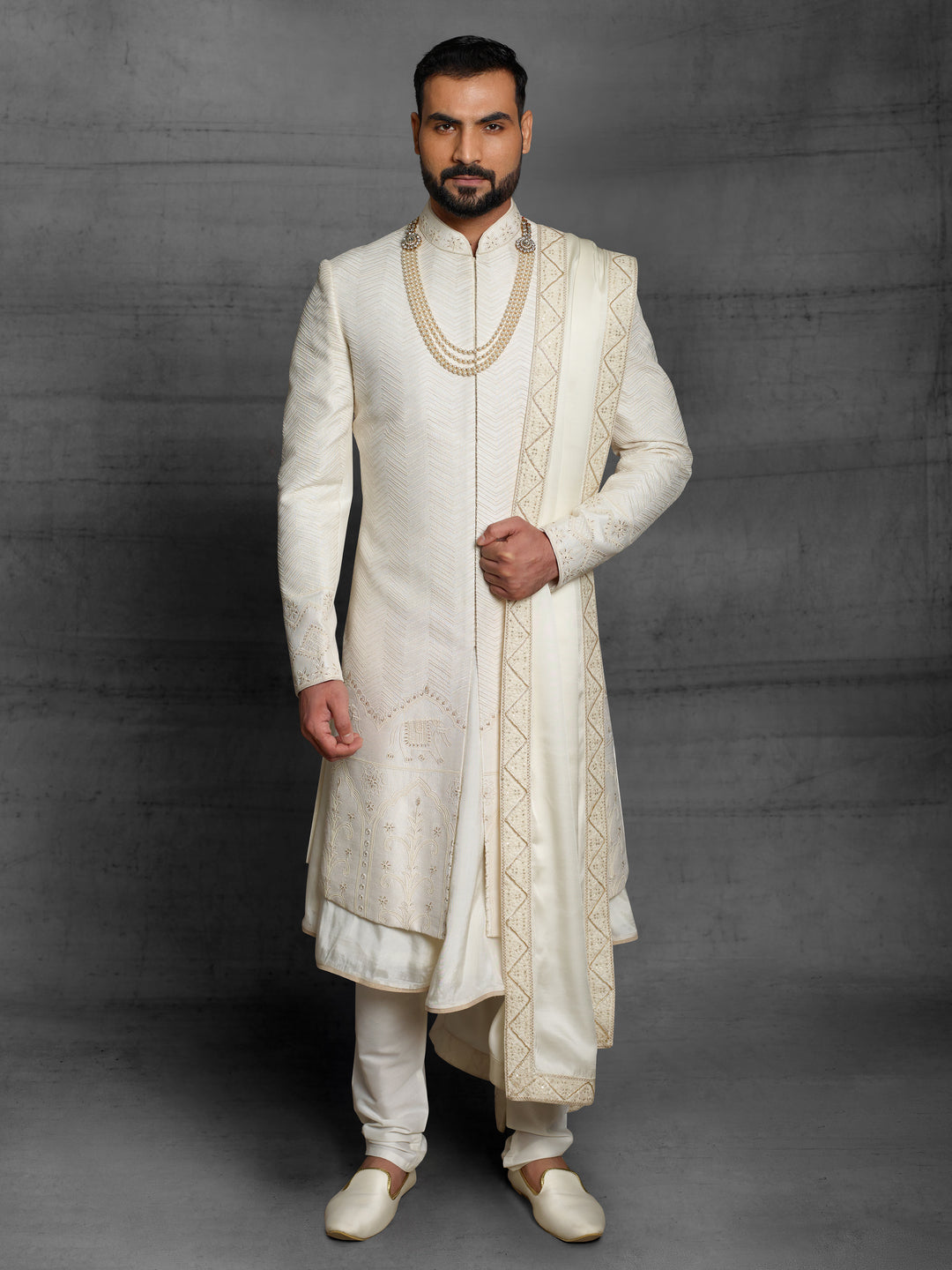 Off-white sherwani with elephant motif on daman