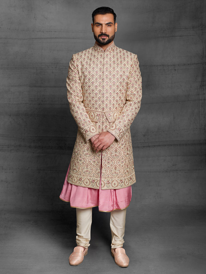 Gold sherwani with symmetric design and traditional kamarbandh