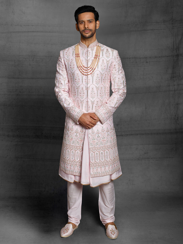 Designer groomwear sherwani in powder pink color.
