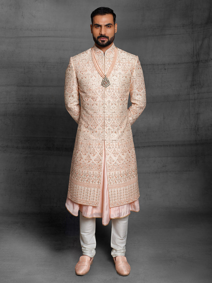 Peach sherwani with metallic rose gold resham embroidery.