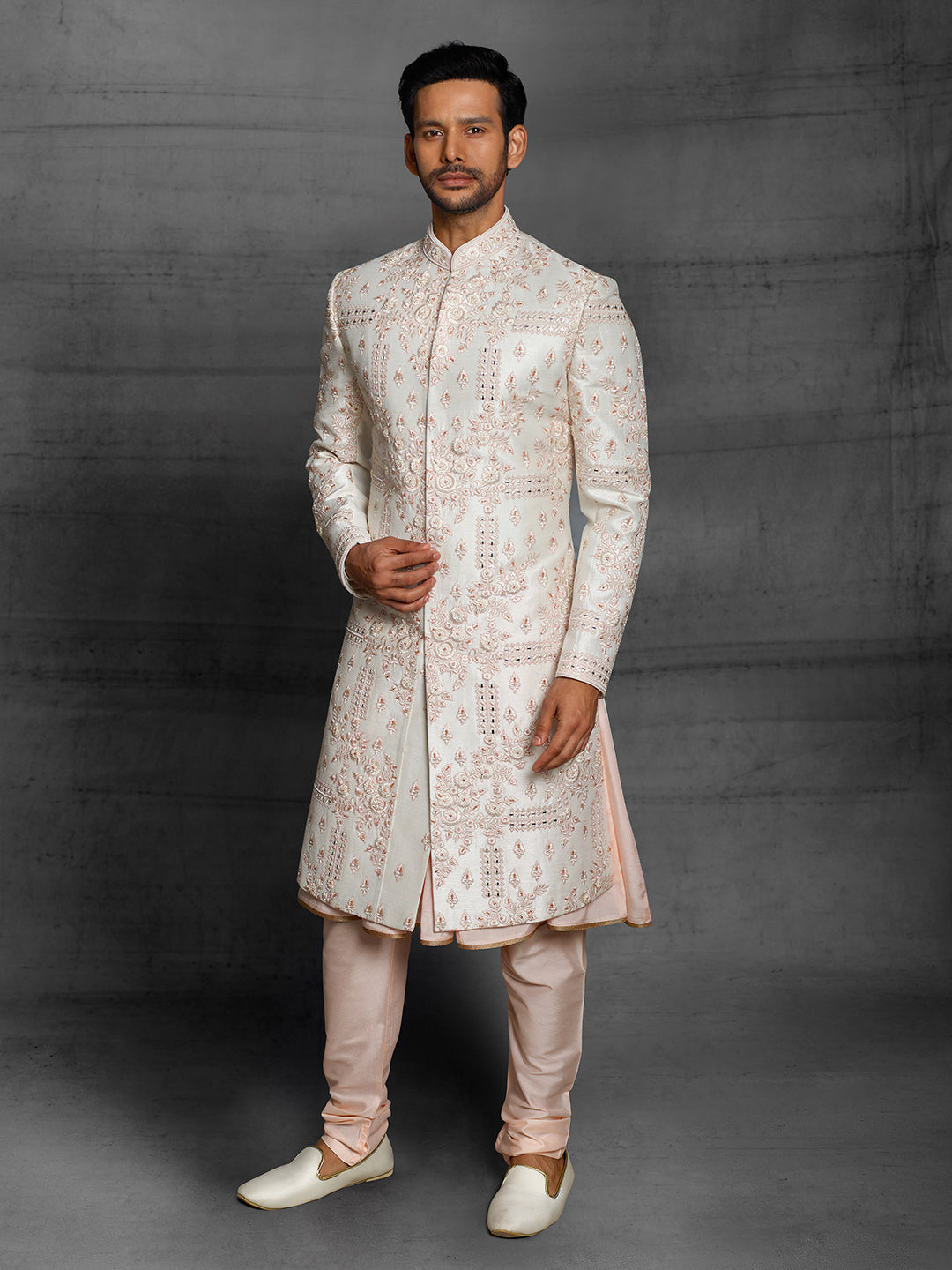 Off-white sherwani peach resham karigiri.