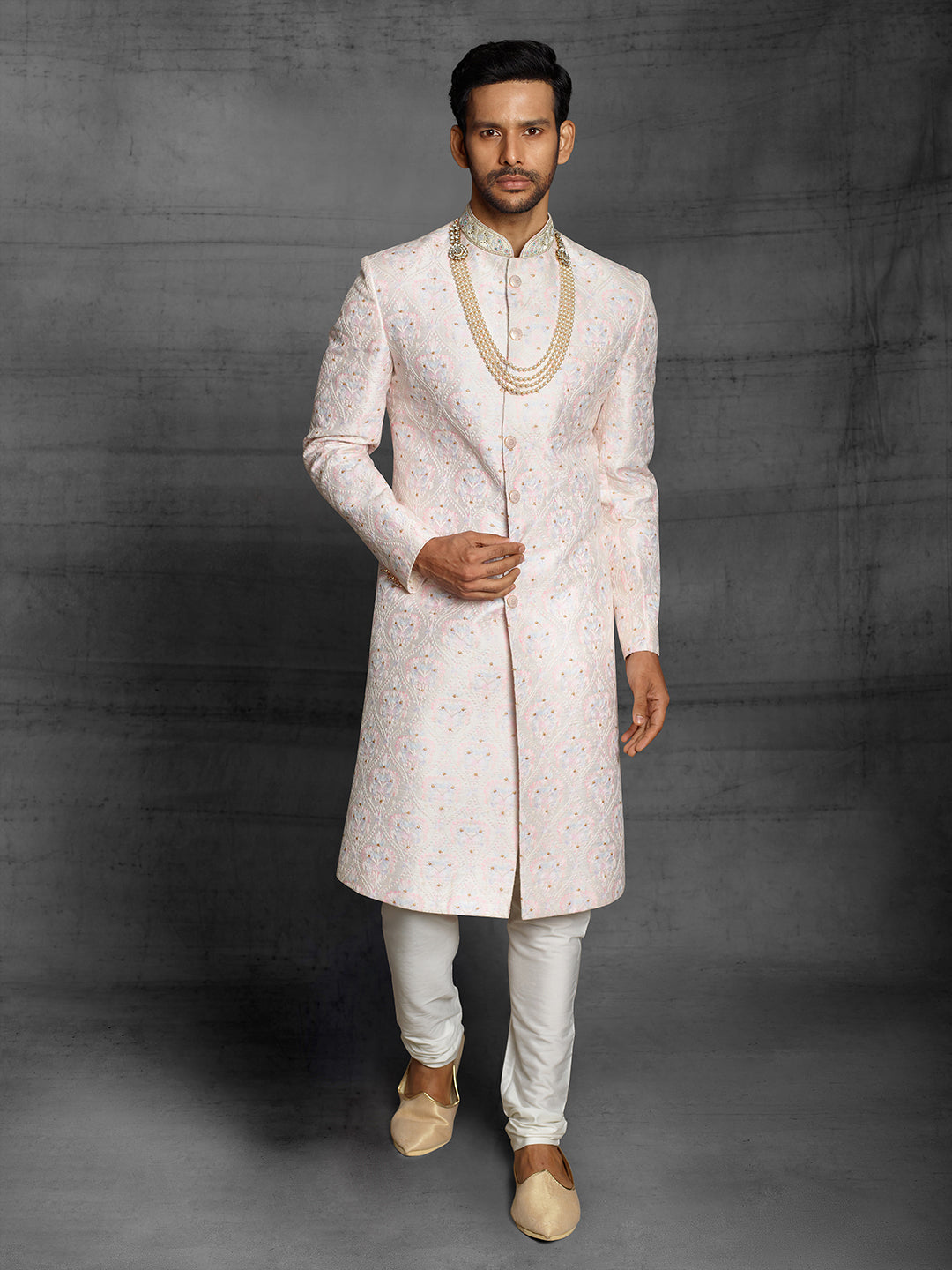 Simple silk sherwani with Resham embroidery.