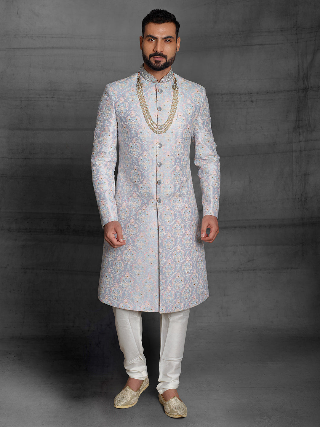 Simple silk sherwani with Resham embroidery.