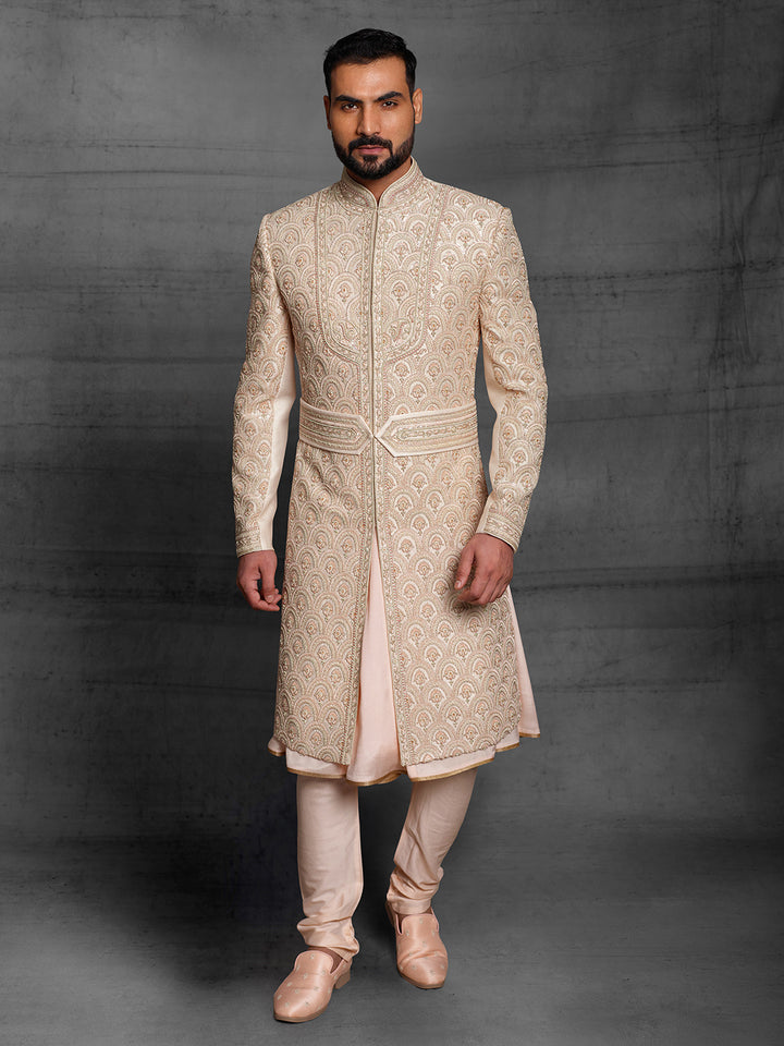 Overall embroidered sherwani in light gold color.