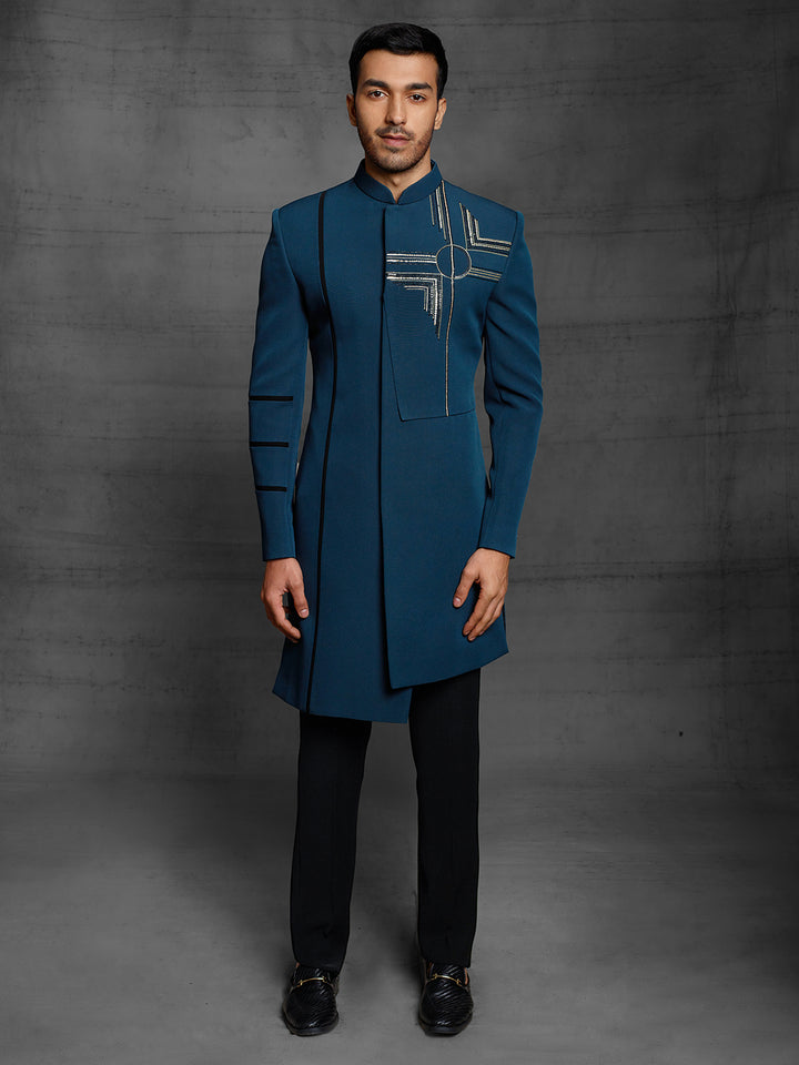 Teal blue indo-western with modern artwork.