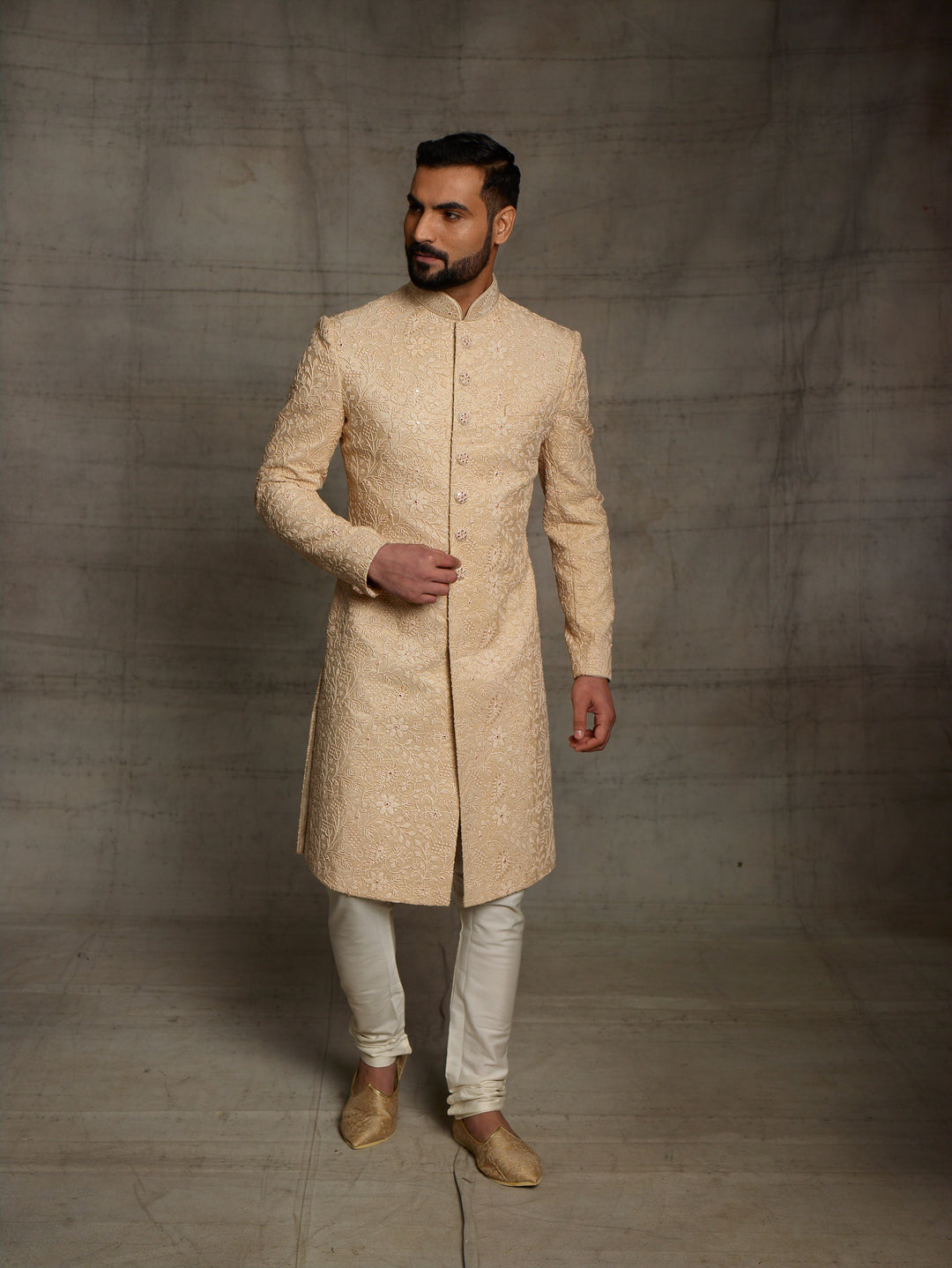 Classic gold sherwani in net fabric.