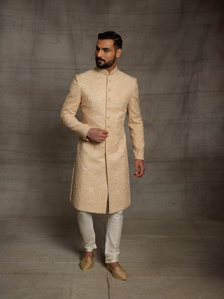 Classic gold sherwani in net fabric.