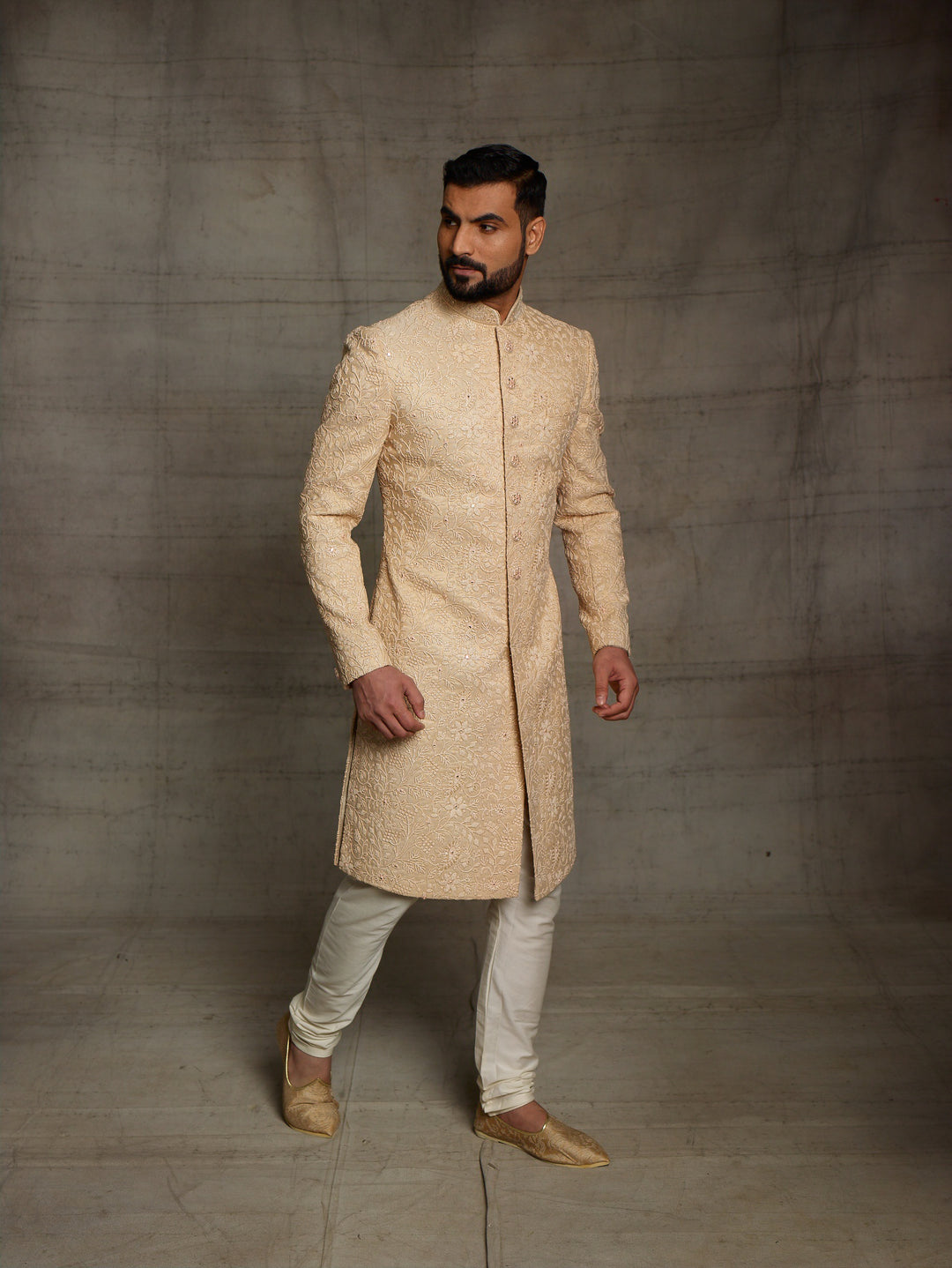 Classic gold sherwani in net fabric.