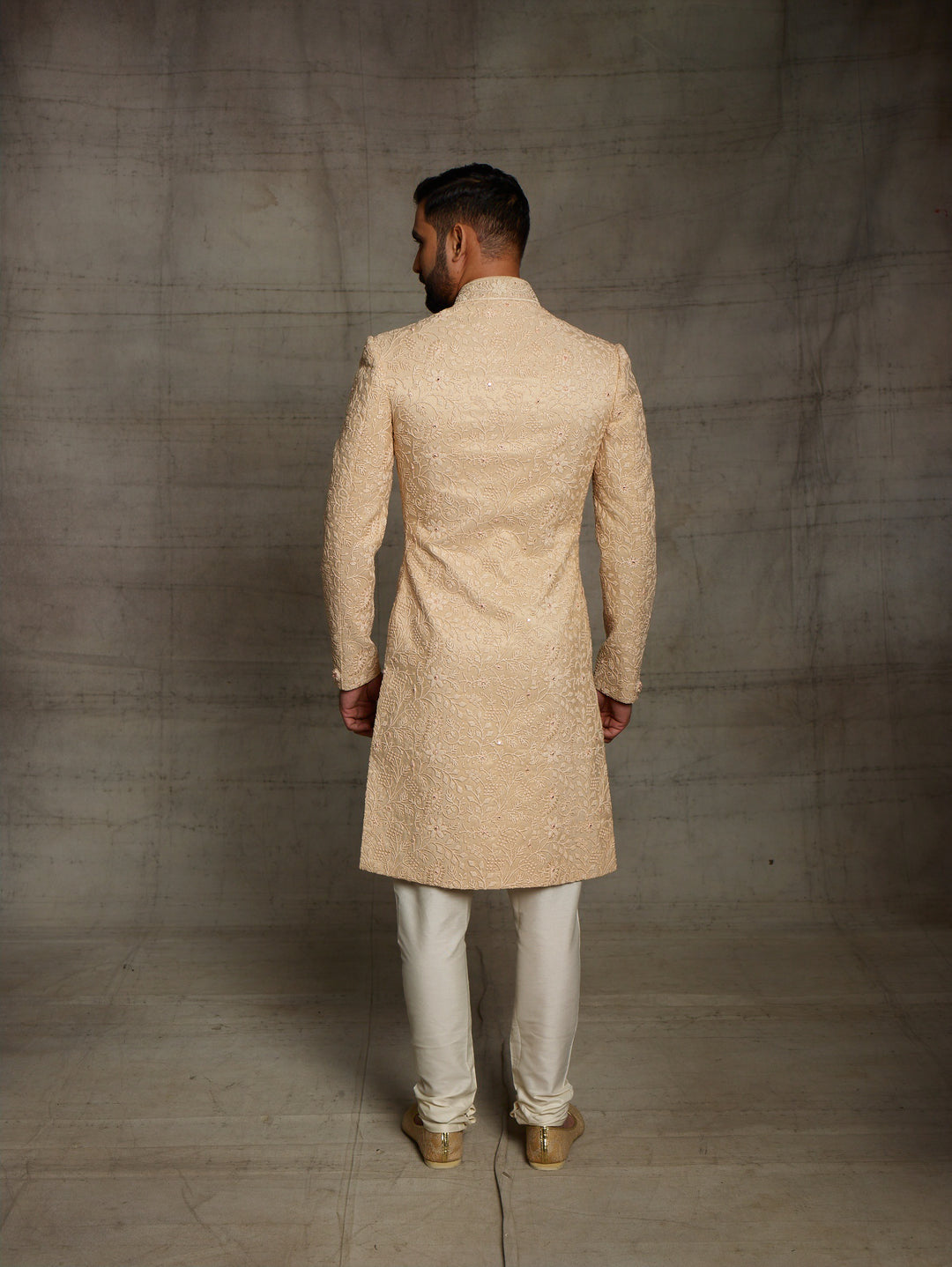 Classic gold sherwani in net fabric.