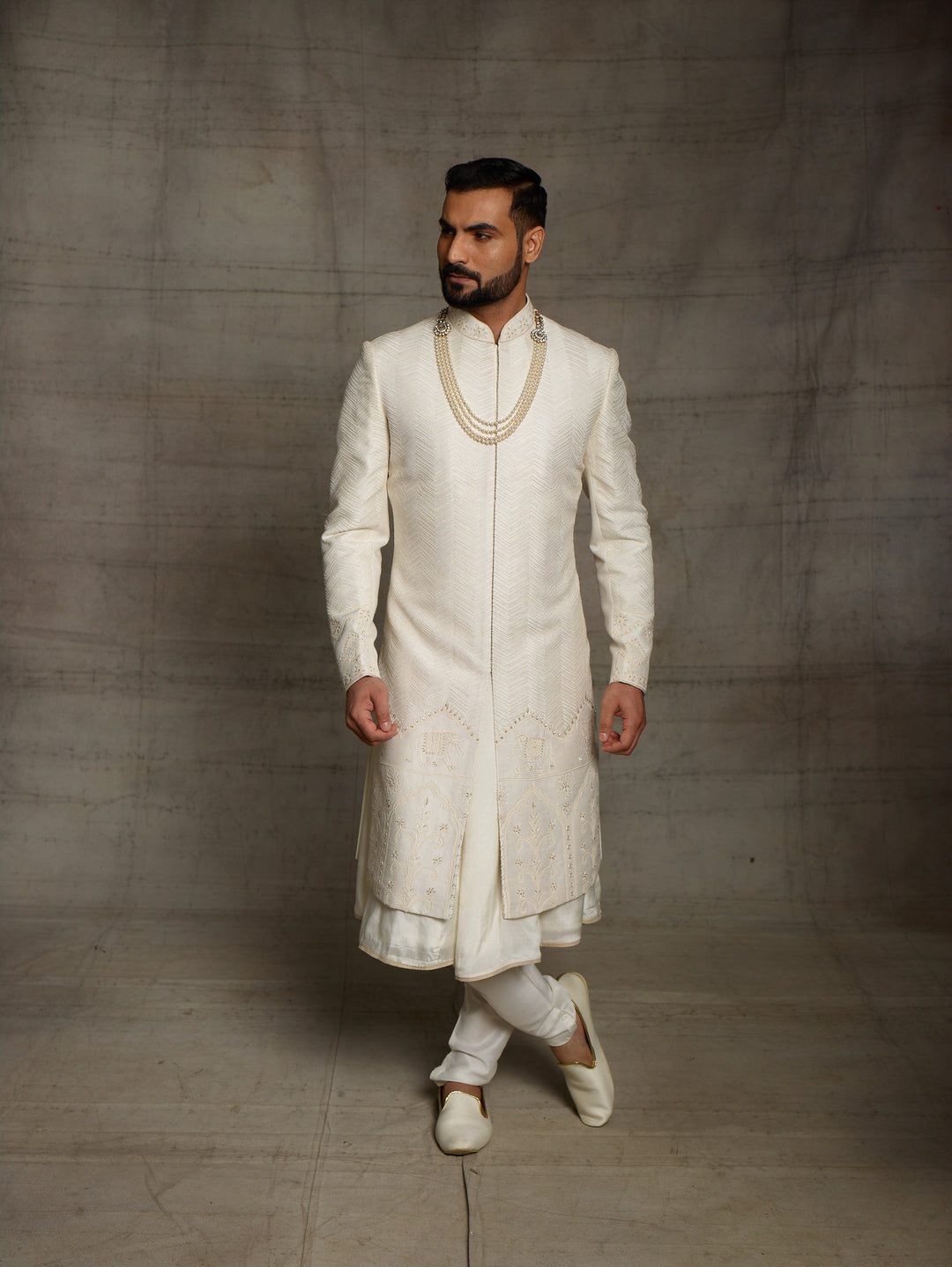 Off-white sherwani with elephant motif on daman