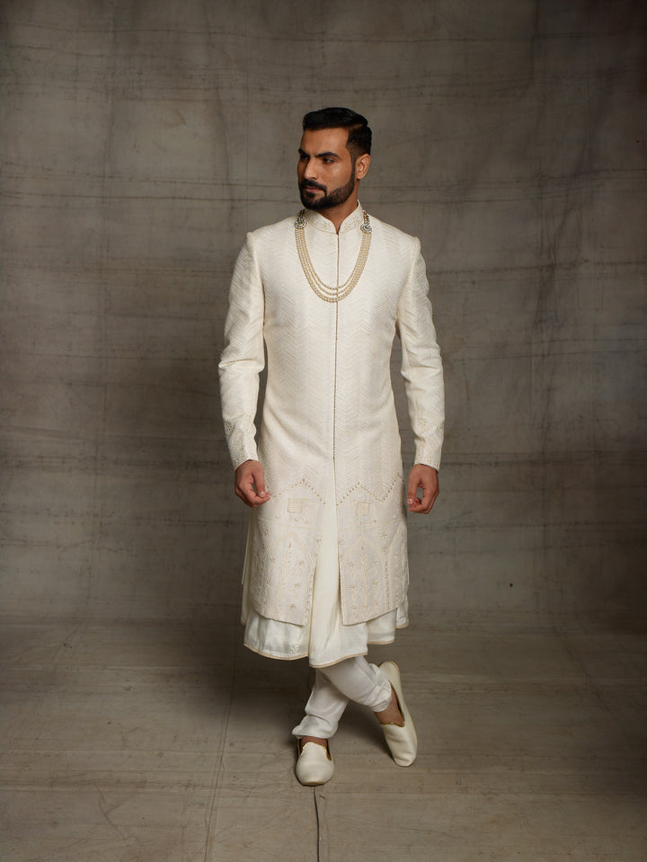 Off-white sherwani with elephant motif on daman