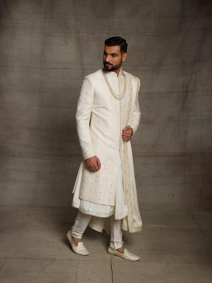 Off-white sherwani with elephant motif on daman