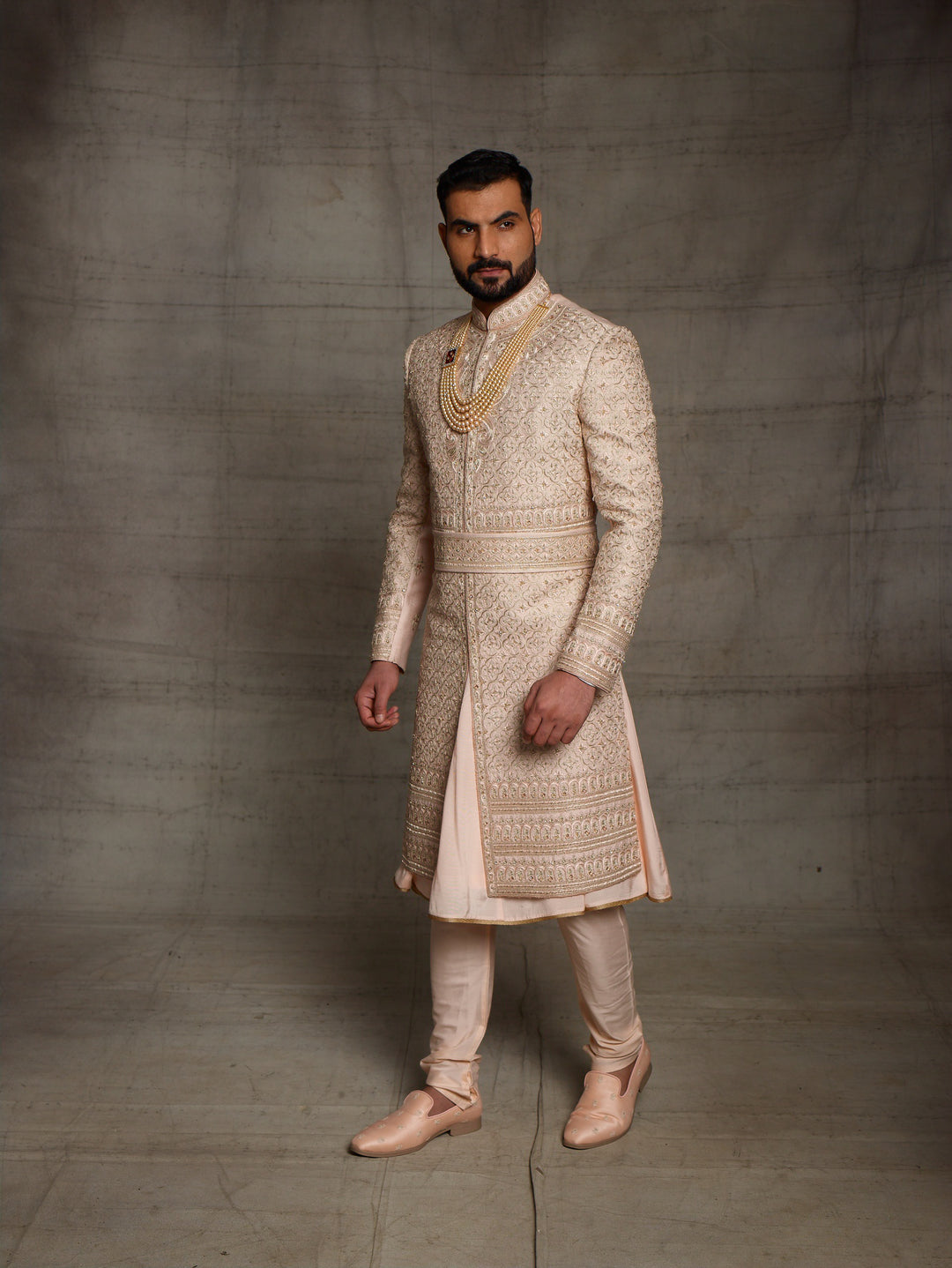 Heavy zardose sherwani with matching kamarbandh.