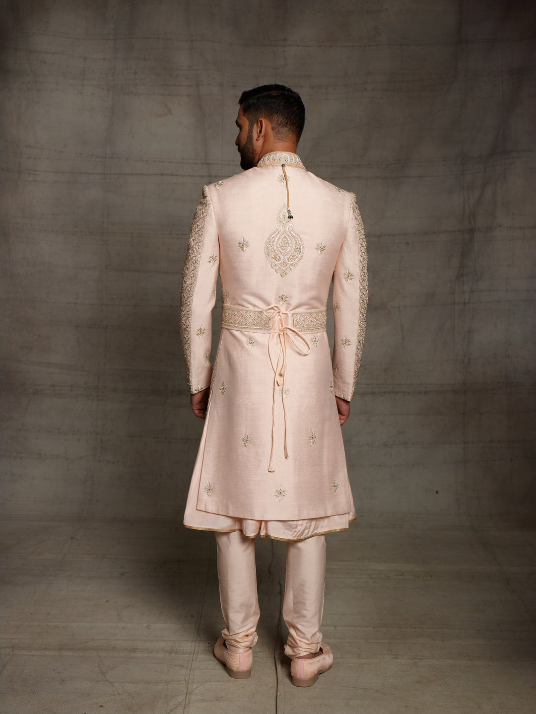 Heavy zardose sherwani with matching kamarbandh.