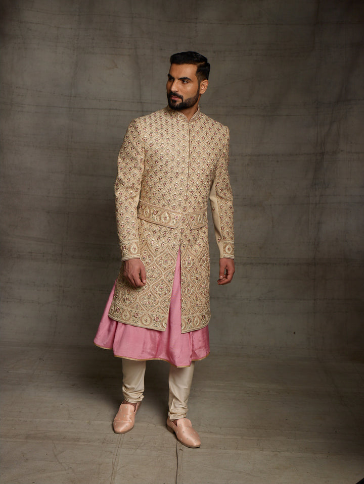 Gold sherwani with symmetric design and traditional kamarbandh