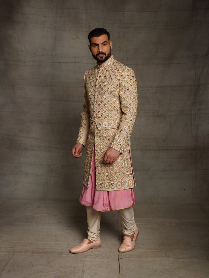 Gold sherwani with symmetric design and traditional kamarbandh