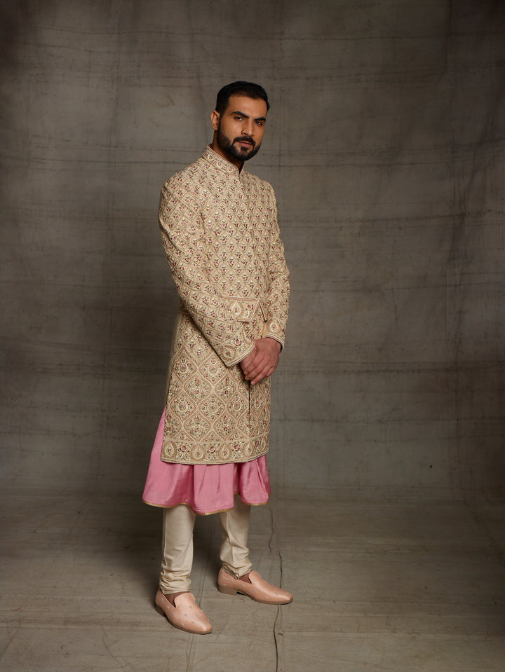 Gold sherwani with symmetric design and traditional kamarbandh