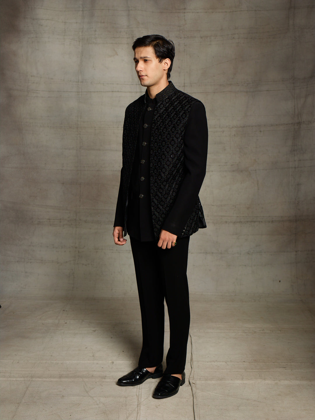 Black jodhpuri with velvet jacket.
