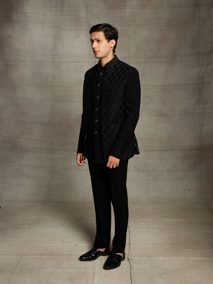 Black jodhpuri with velvet jacket.