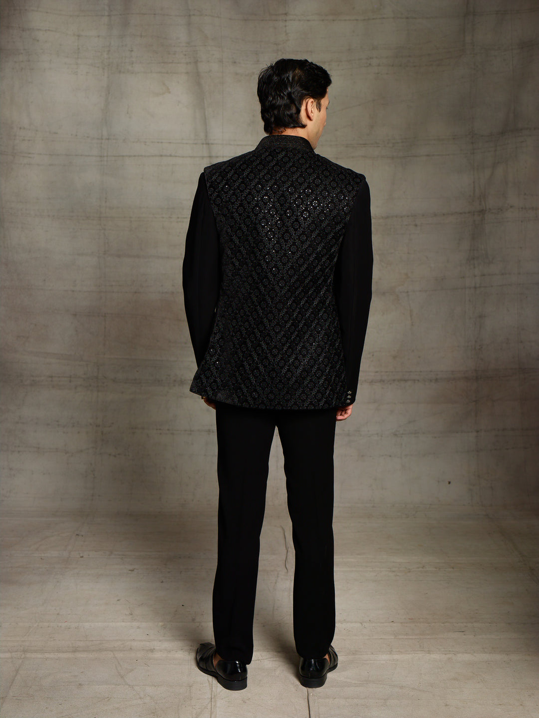 Black jodhpuri with velvet jacket.