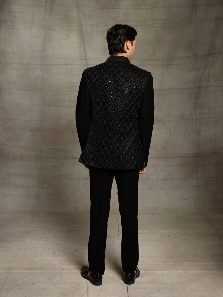 Black jodhpuri with velvet jacket.