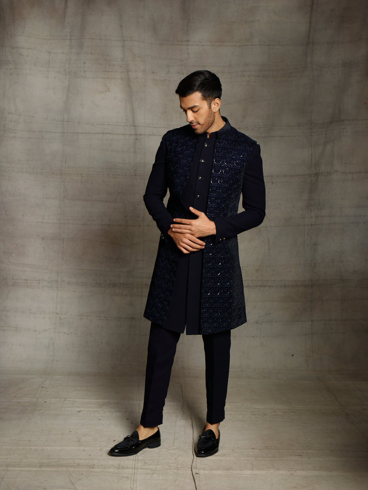Blue indo-western with front open sleeveless velvet jacket.