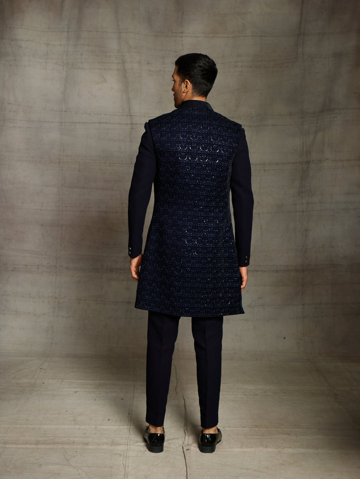 Blue indo-western with front open sleeveless velvet jacket.