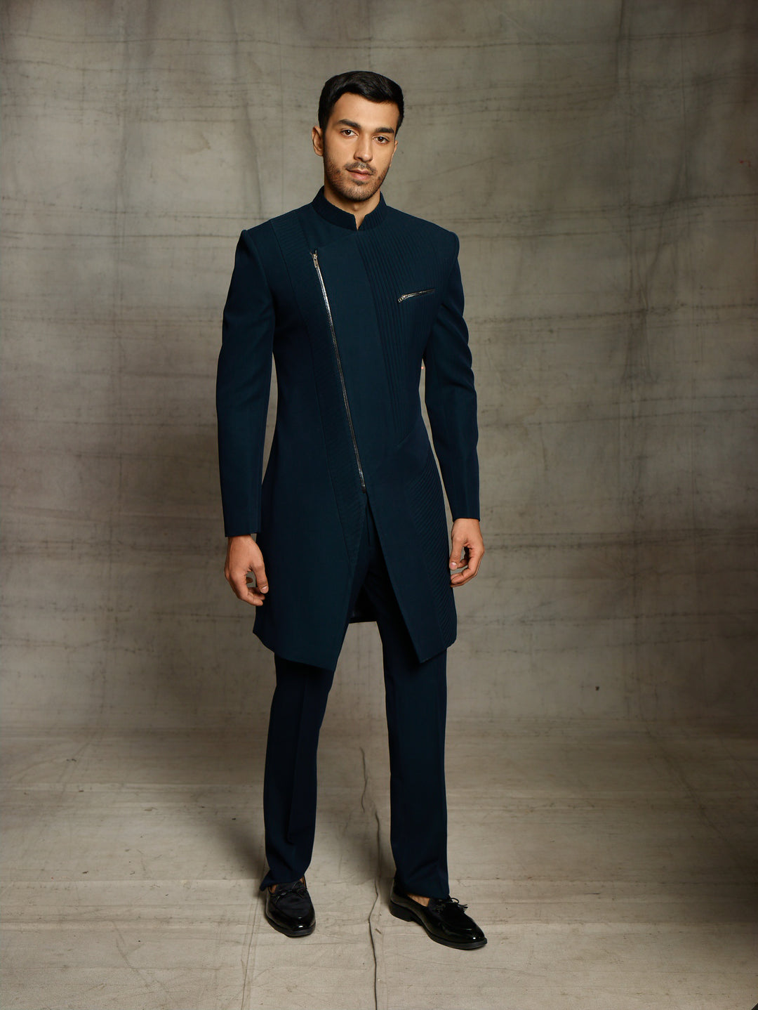 Modern look indo-western in teal green color.