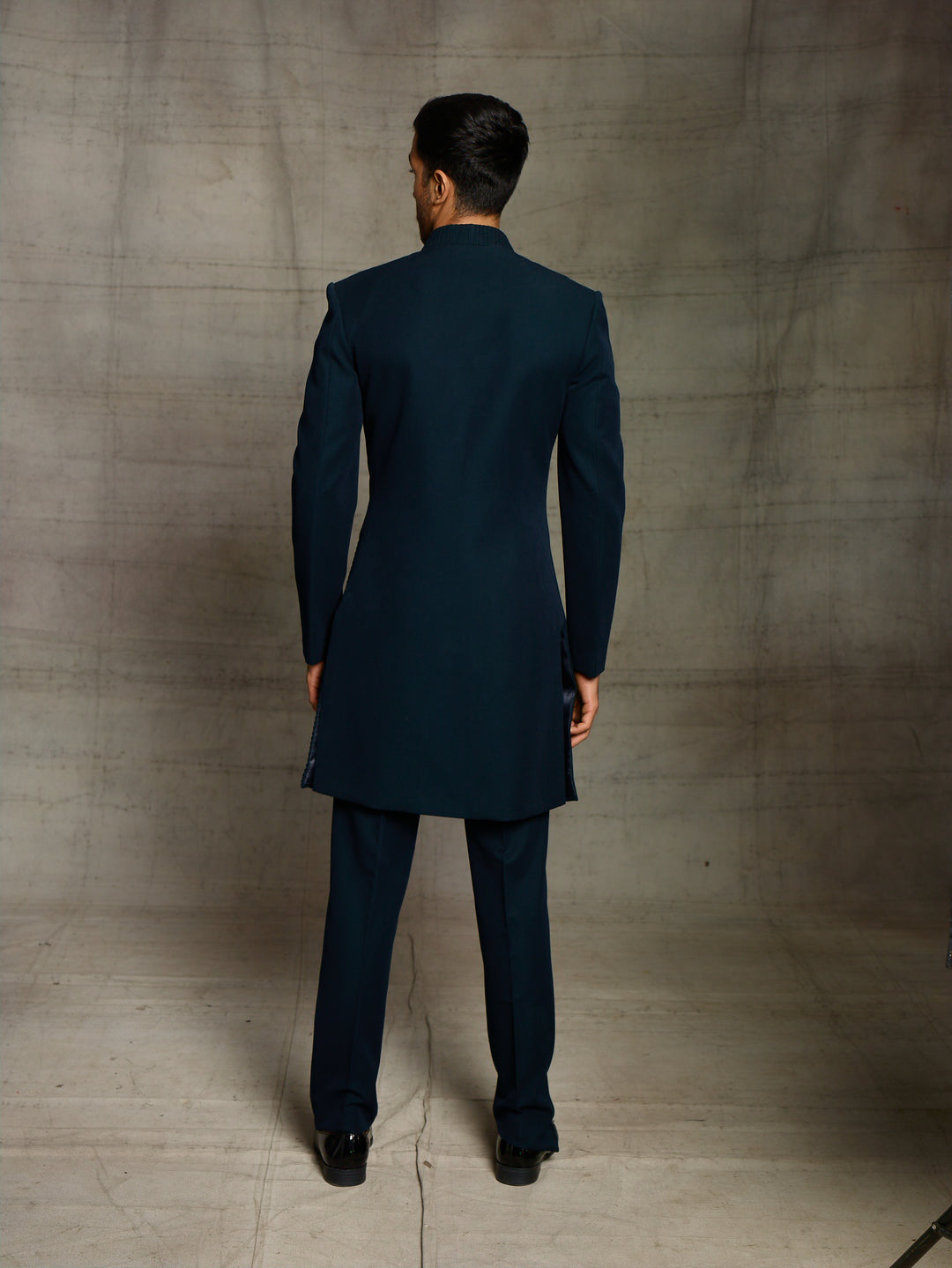 Modern look indo-western in teal green color.