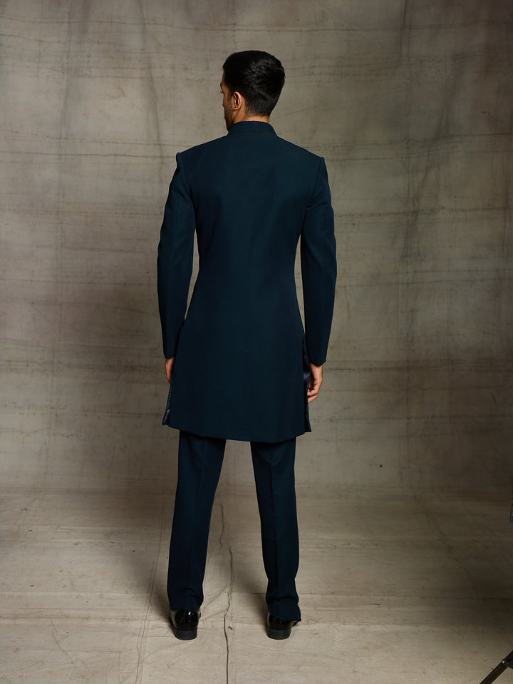 Modern look indo-western in teal green color.