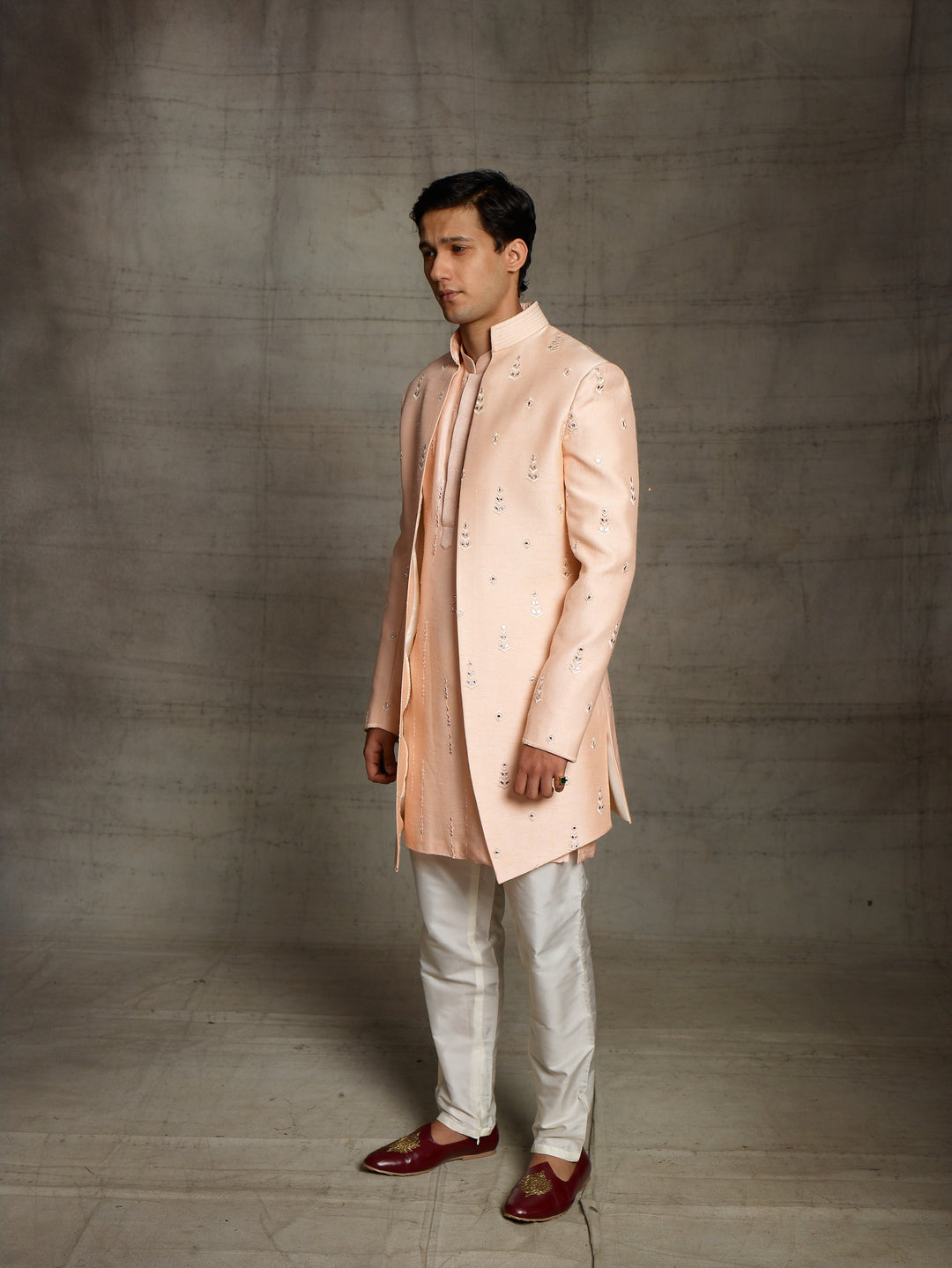 Jacket style indo-western in peach color.