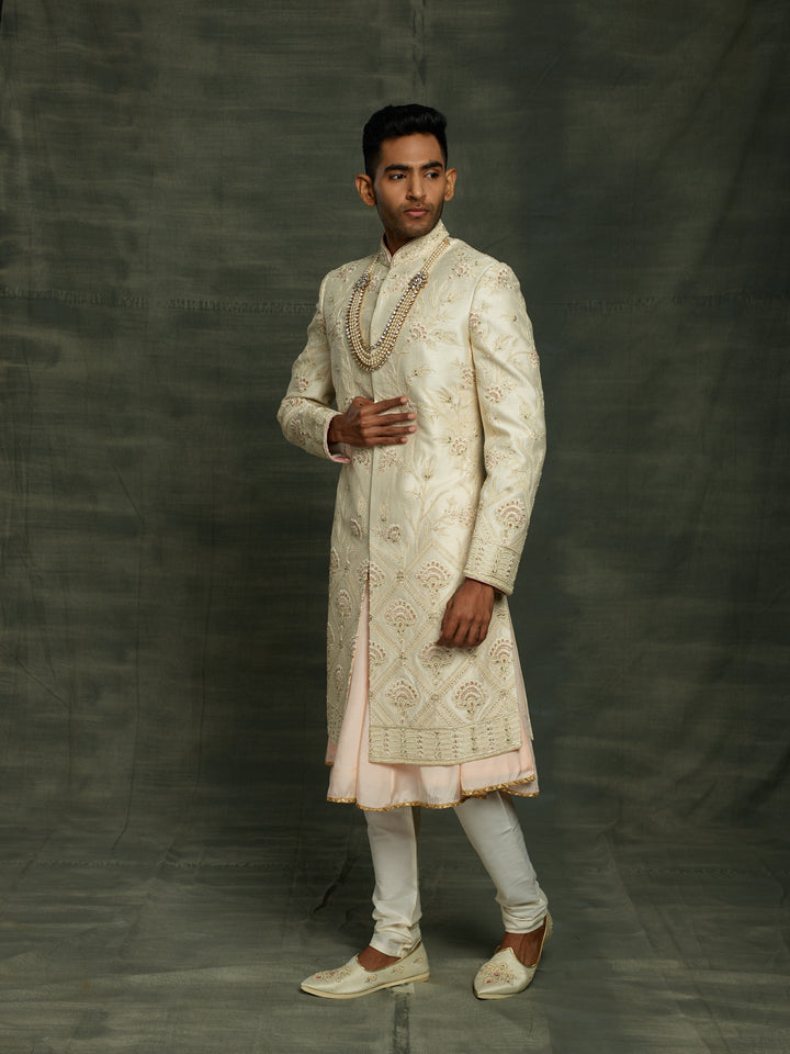Off-white sherwani with self to self floral motifs