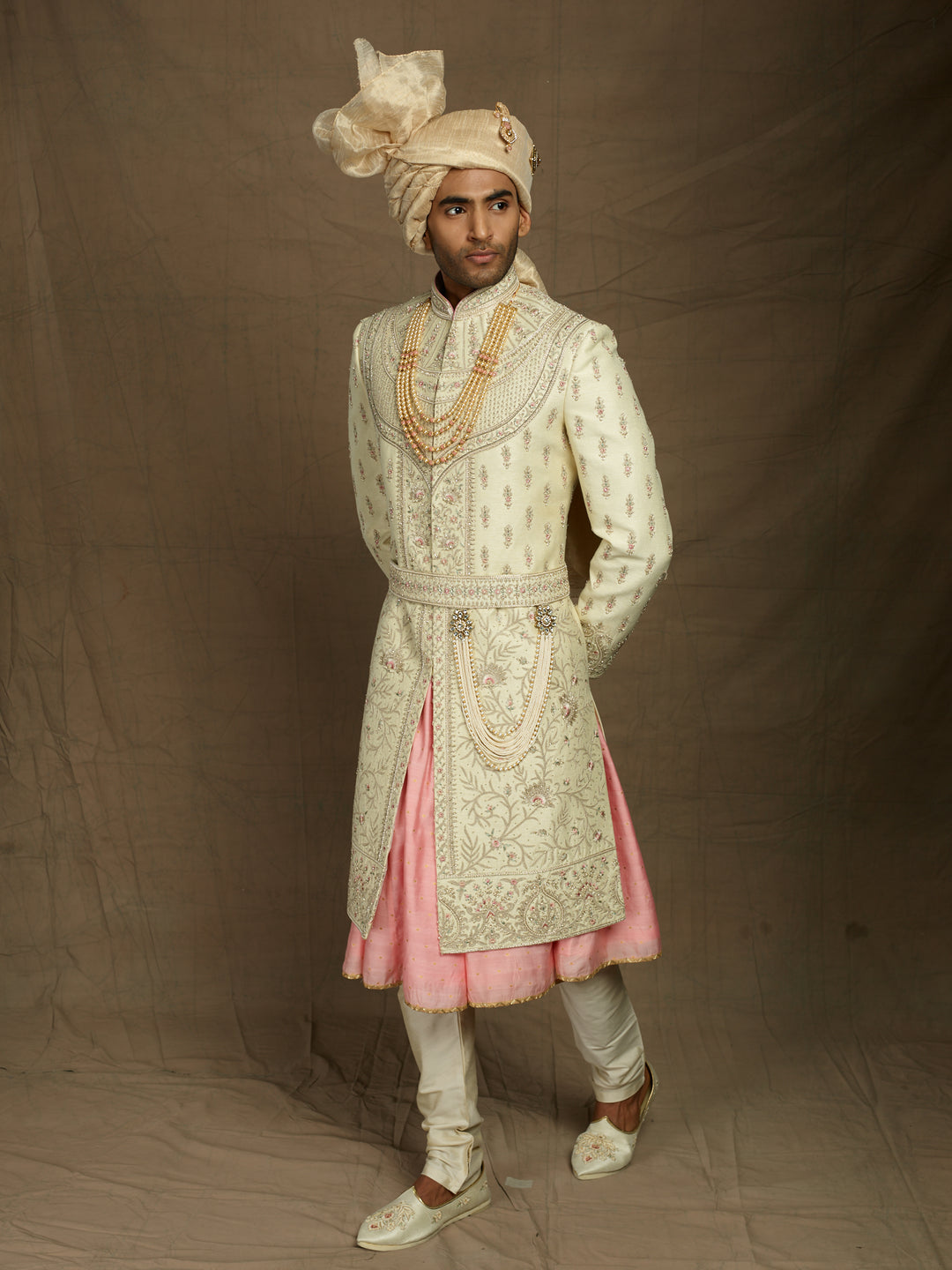 Heavy groom's wear sherwani with pink combination.